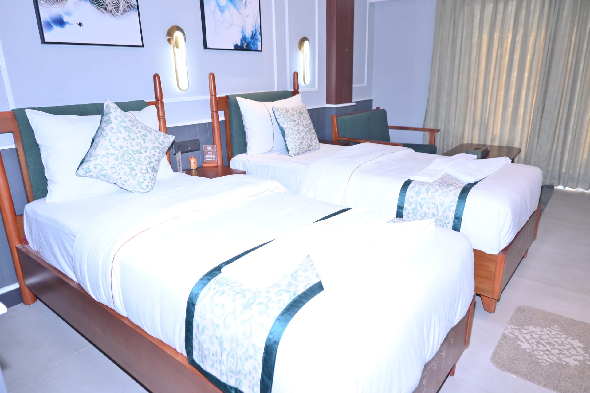 Twin bedded room with garden-side windows