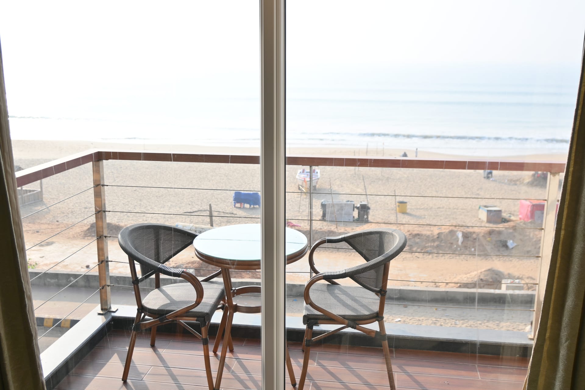 Private balcony seating with a direct view of Puri beach